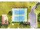 Overhead view of tennis courts and parking area, surrounded by green trees at 1515 Kingdom Way, Fort Mill, SC 29707