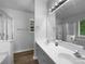 Bright bathroom with dual sinks, new vanity, large mirror, and a walk in shower at 1523 Merrie Meadow Ct, Rock Hill, SC 29732