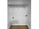 Storage closet with wooden style flooring, and a white wire shelf for organization at 1523 Merrie Meadow Ct, Rock Hill, SC 29732