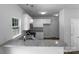 This eat-in kitchen features a granite countertop, white cabinetry, and a stainless steel microwave at 1523 Merrie Meadow Ct, Rock Hill, SC 29732