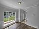Bright, open living room features windows and wainscoting detail, offering natural light at 1523 Merrie Meadow Ct, Rock Hill, SC 29732