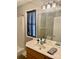 Bathroom featuring a single sink vanity, a large mirror, and a shower/tub combination at 1700 Pickwick Ave, Kannapolis, NC 28083