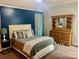 Primary bedroom with a tall ceiling and neutral decor at 1700 Pickwick Ave, Kannapolis, NC 28083