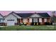 Charming single-story home with brick accents, well-maintained lawn, and inviting front porch at 1700 Pickwick Ave, Kannapolis, NC 28083