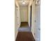 Neutral hallway featuring carpet and multiple doors at 1700 Pickwick Ave, Kannapolis, NC 28083