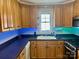 Kitchen with wood cabinetry, stainless steel appliances, and a double bowl sink at 1700 Pickwick Ave, Kannapolis, NC 28083