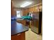 Bright kitchen features stainless steel appliances, durable countertops, and light wood cabinetry at 1700 Pickwick Ave, Kannapolis, NC 28083