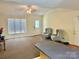 Open living room area with neutral walls, plush carpeting, and large window at 1700 Pickwick Ave, Kannapolis, NC 28083