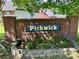 Community entrance sign with brick pillars and stone accents in a landscaped setting at 1700 Pickwick Ave, Kannapolis, NC 28083