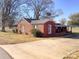 Charming brick home with a covered porch and a spacious driveway at 176 Travis Loop, Statesville, NC 28625