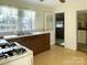 Functional kitchen with classic cabinetry, double sinks, and vintage elements at 176 Travis Loop, Statesville, NC 28625