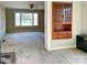 Sunlit living room featuring a vintage built-in cabinet and large windows at 176 Travis Loop, Statesville, NC 28625