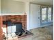 Living area featuring a wood-burning stove and an adjacent window at 176 Travis Loop, Statesville, NC 28625