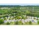 An aerial view showcases the neighborhood's lush tree cover and proximity to the lake at 18522 Victoria Bay Dr, Cornelius, NC 28031