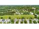 Aerial view of a suburban neighborhood surrounded by mature trees and lush greenery at 18522 Victoria Bay Dr, Cornelius, NC 28031