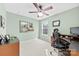 Comfortable bedroom or home office with light green walls and neutral carpeting at 18522 Victoria Bay Dr, Cornelius, NC 28031