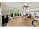 Bright living room boasting large windows overlooking landscaped yard and opening to the kitchen at 18522 Victoria Bay Dr, Cornelius, NC 28031