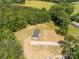 Aerial view of home with partially fenced lot, lawn, and surrounding trees at 2007 Sugar Hill Rd, York, SC 29745