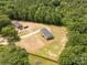 Aerial view of the house with a large, green lot, additional outbuilding and fenced yard at 2007 Sugar Hill Rd, York, SC 29745