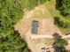 A bird's eye view displays a house with nice yard, fencing, and bordering trees at 2007 Sugar Hill Rd, York, SC 29745
