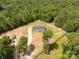 Aerial view of the house with a large, green lot and surrounding trees and fenced in yard at 2007 Sugar Hill Rd, York, SC 29745