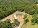 A serene aerial view shows a charming home surrounded by lush greenery and a well-manicured lawn at 2007 Sugar Hill Rd, York, SC 29745