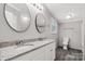 Bathroom featuring dual sinks, granite counters, and modern fixtures at 2007 Sugar Hill Rd, York, SC 29745