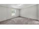 Bright bedroom with neutral walls, carpet, and a sunlit window at 2007 Sugar Hill Rd, York, SC 29745