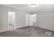 A bedroom featuring neutral walls, plush carpeting, and two doorways at 2007 Sugar Hill Rd, York, SC 29745