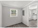 Neutral bonus room with gray laminate flooring and natural light at 2007 Sugar Hill Rd, York, SC 29745