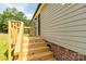 Exterior wooden stairs leading up to the door of the light-colored home at 2007 Sugar Hill Rd, York, SC 29745