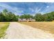 Charming single-Gathering home with gravel driveway and welcoming front entrance at 2007 Sugar Hill Rd, York, SC 29745
