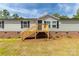 Beautiful gray single-Gathering home with new natural wood porch at 2007 Sugar Hill Rd, York, SC 29745