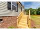 Close up view of a newly built wood porch and brick base at 2007 Sugar Hill Rd, York, SC 29745