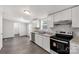 Bright kitchen featuring stainless steel appliances, granite countertops, and white cabinetry at 2007 Sugar Hill Rd, York, SC 29745