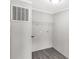 Simple laundry room with laminate flooring, utility hookups, and a wire shelf at 2007 Sugar Hill Rd, York, SC 29745