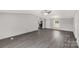Open-concept living room and kitchen area with durable gray flooring at 2007 Sugar Hill Rd, York, SC 29745