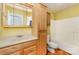 Bathroom featuring a vanity with storage, a toilet, and a bathtub with shower at 203 Ewing Dr, Belmont, NC 28012