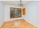 Bedroom with hardwood floors, a large window, and a neutral color palette at 203 Ewing Dr, Belmont, NC 28012