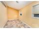 Small bedroom with light yellow walls, linoleum floors and a window at 203 Ewing Dr, Belmont, NC 28012
