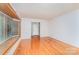 This room features hardwood floors, large windows, and neutral walls at 203 Ewing Dr, Belmont, NC 28012