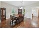 Formal dining room with hardwood floors, chandelier, and traditional decor, with built in cabinet at 214 Tenth St, Cramerton, NC 28032