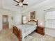 Bright bedroom with a ceiling fan and plenty of natural light at 2343 Mt. Harmony Church Rd, Matthews, NC 28104