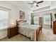Bright bedroom with tray ceiling, a ceiling fan, and natural light at 2343 Mt. Harmony Church Rd, Matthews, NC 28104