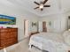 Spacious bedroom with a tray ceiling, ceiling fan, and ensuite bathroom access at 2343 Mt. Harmony Church Rd, Matthews, NC 28104