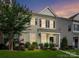 Charming two-story home features a landscaped front yard with lush greenery and a welcoming entrance at 2343 Mt. Harmony Church Rd, Matthews, NC 28104