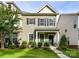 Charming two-story home with a covered front porch and vibrant, landscaped yard at 2343 Mt. Harmony Church Rd, Matthews, NC 28104