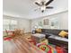 Spacious living room with hardwood floors, a comfortable sofa, and an adjacent dining area at 2343 Mt. Harmony Church Rd, Matthews, NC 28104