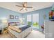 Comfortable bedroom with a ceiling fan, natural light from the windows, and a cozy, inviting atmosphere at 256 Rose St, Mooresville, NC 28117