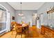 Dining room with beautiful hardwood floors and traditional furnishings at 256 Rose St, Mooresville, NC 28117